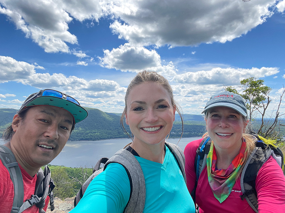 Female mountaineer Vanessa O'Brien climbing the summit of a mountain.